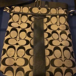 Black and brown Coach crossbody bag